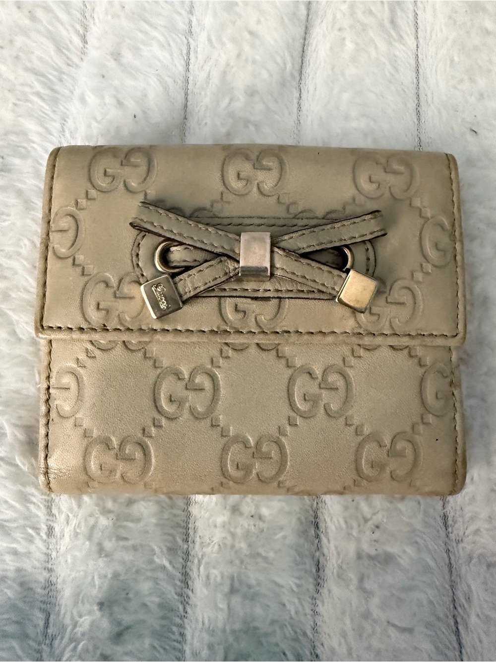 Gucci Beige Embossed GG Leather Wallet with Bow Accent and Metal Tips